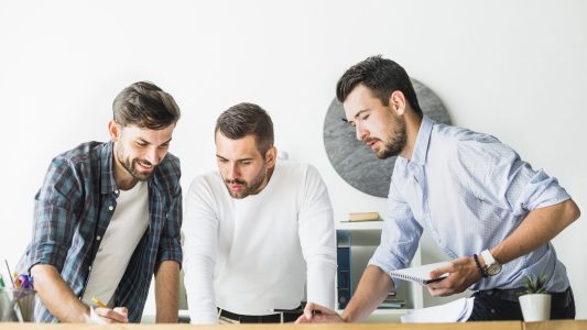 group-young-male-architect-working-office